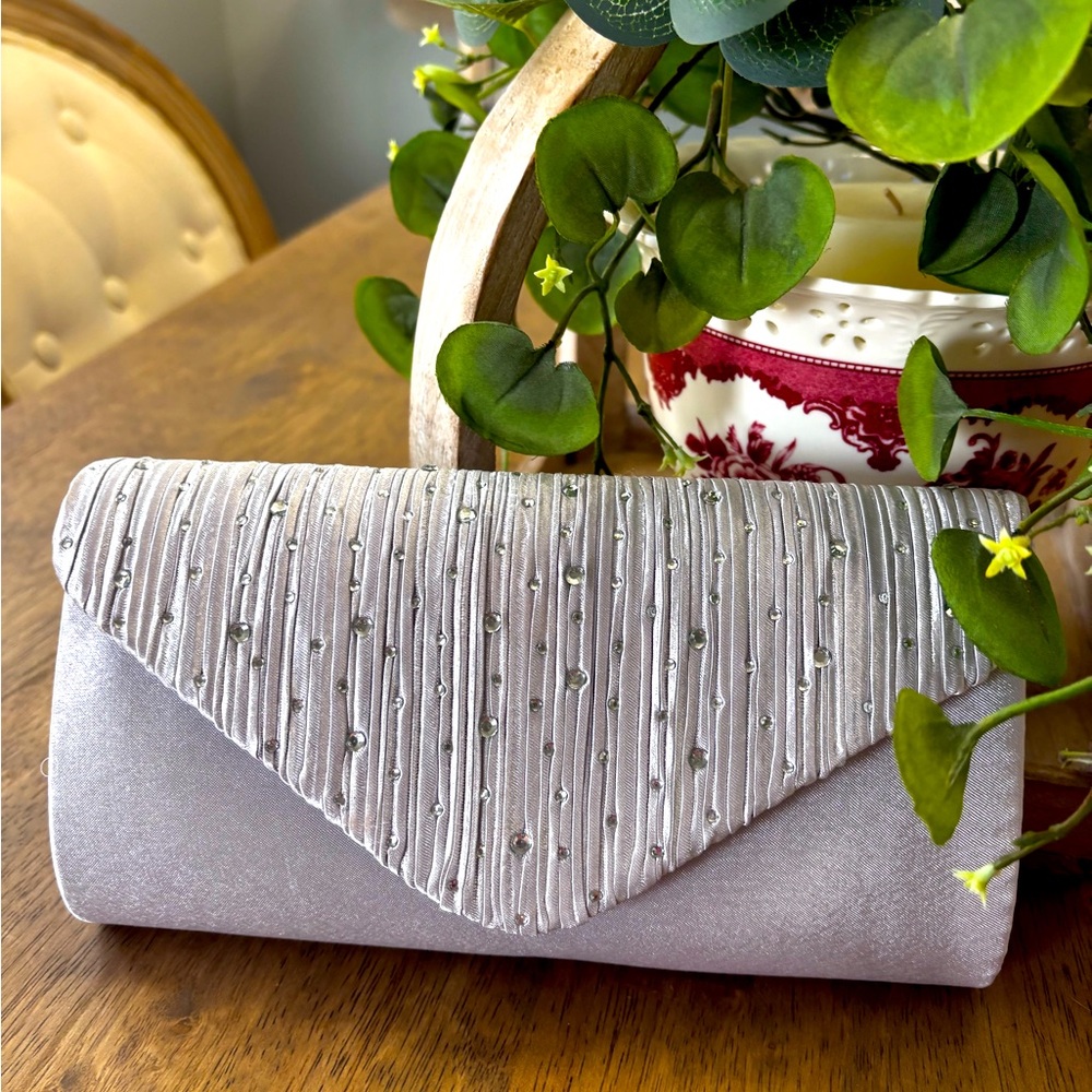 Silver satin evening clutch with snap closure NWOT
